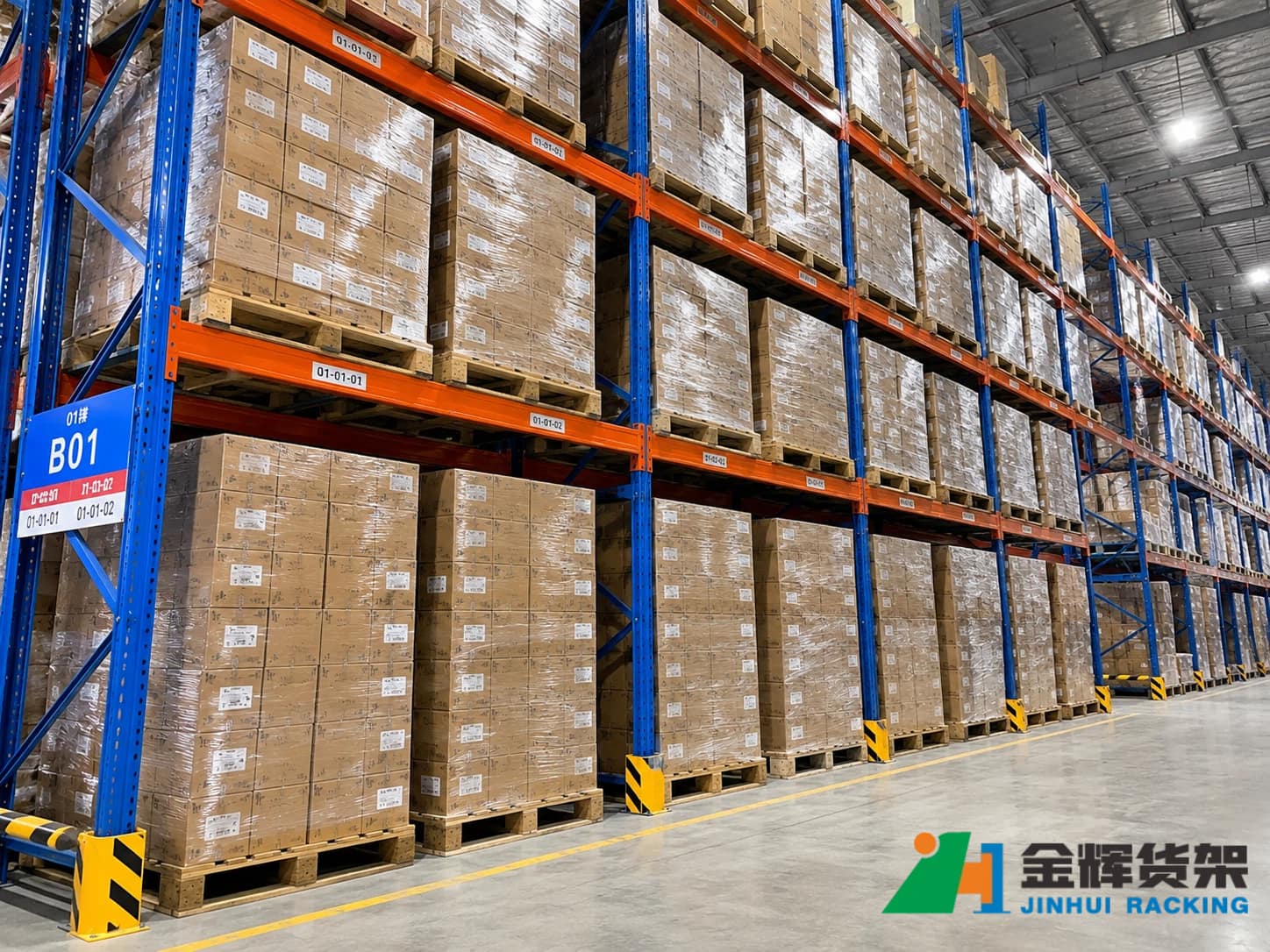 Heavy duty selective pallet racking storing fully loaded industrial pallets Heavy duty selective pallet racking storing fully loaded industrial pallets